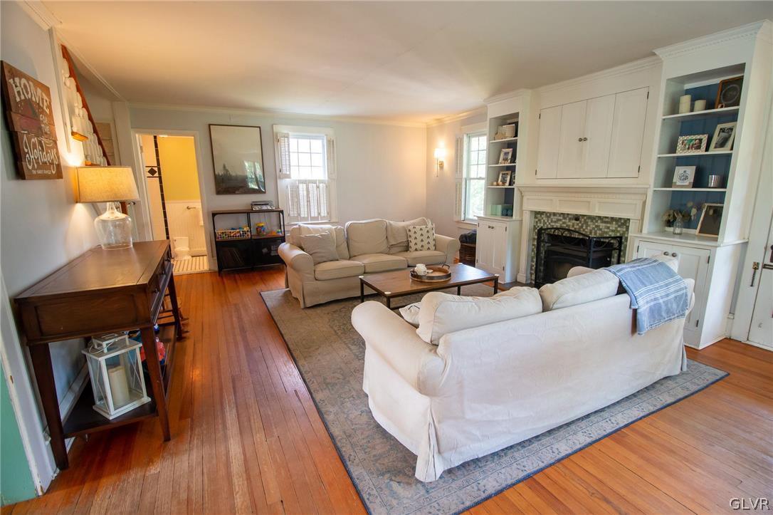 817 Easton Road Riegelsville, PA 18077 - Photo 19 of 43 a living room with furniture fireplace and a flat screen tv