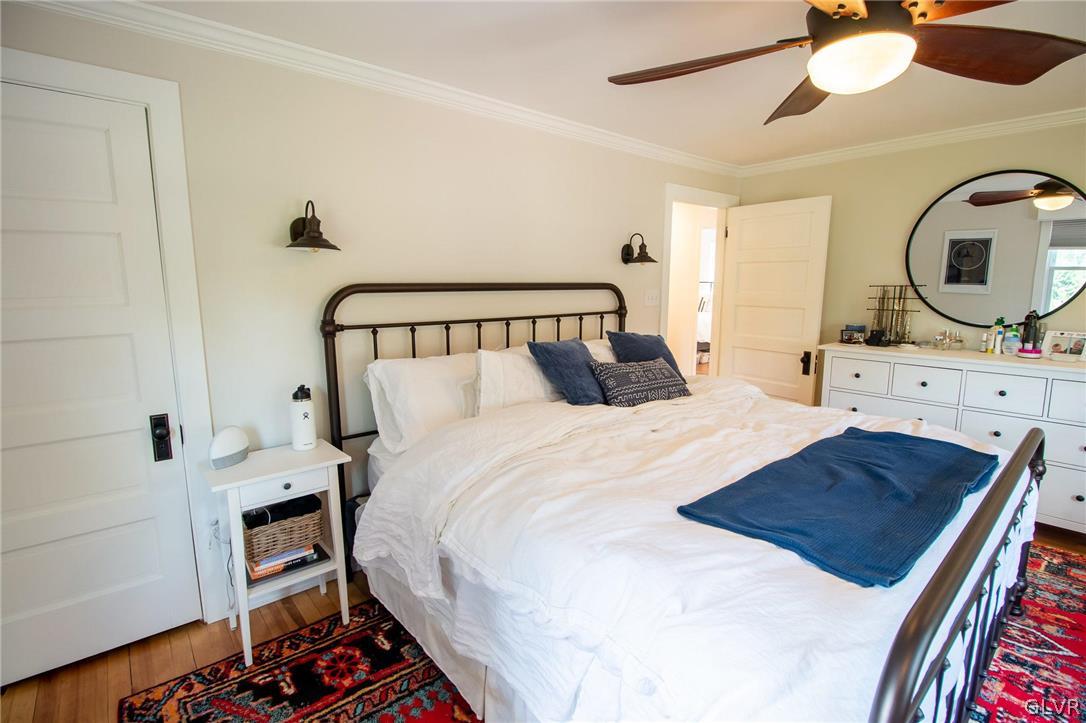 817 Easton Road Riegelsville, PA 18077 - Photo 31 of 43 a bedroom with a bed and a chandelier