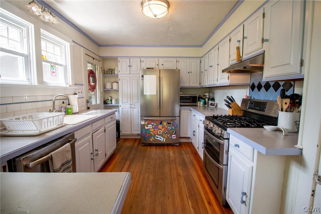 817 Easton Road Riegelsville, PA 18077 - Photo 10 of 43 a kitchen with stainless steel appliances granite countertop a sink stove and refrigerator