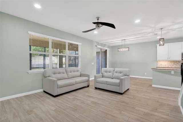 a living room with furniture and a large window