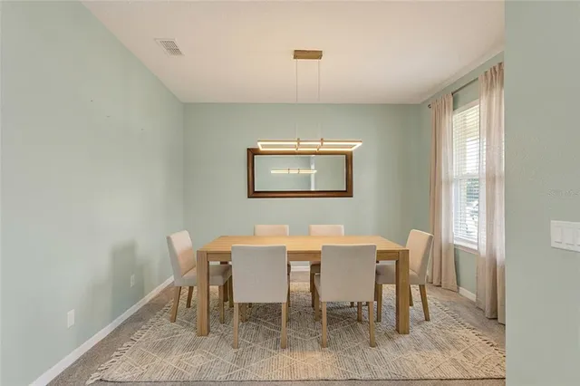 a view of a dining room with furniture