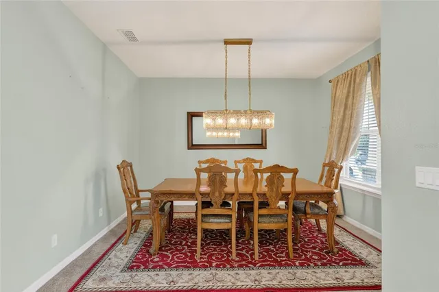 a dining room with furniture a rug and a rug
