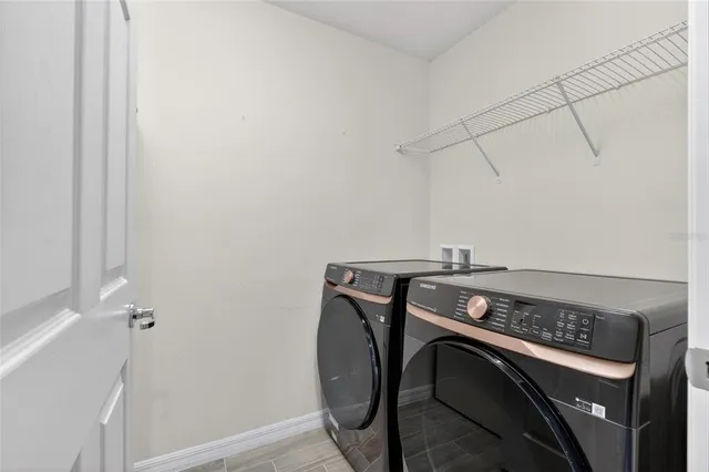 a utility room with dryer and washer