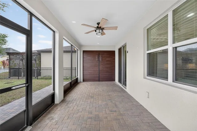 a view of a hallway with windows