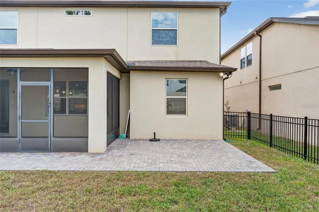 a view of a house with a backyard