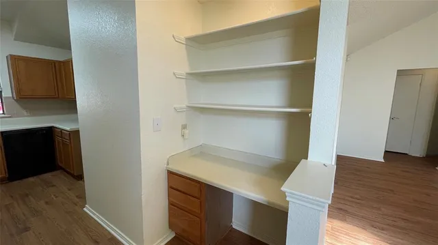 a view of storage and utility room in wooden floor