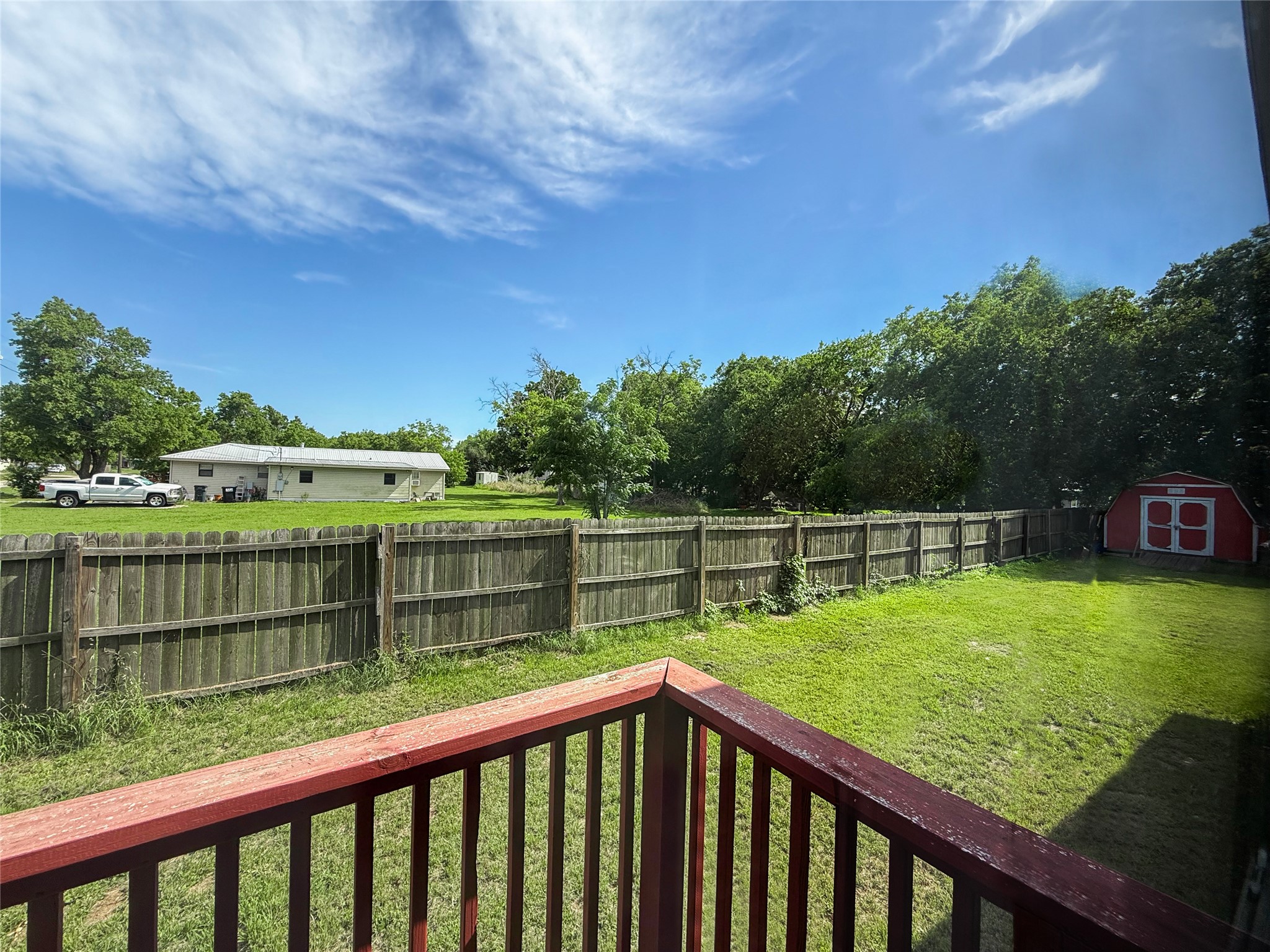 845 Caldwell Street Lexington, TX 78947 - Photo 19 of 39 View of side yard featuring a storage shed and an outdoor structure