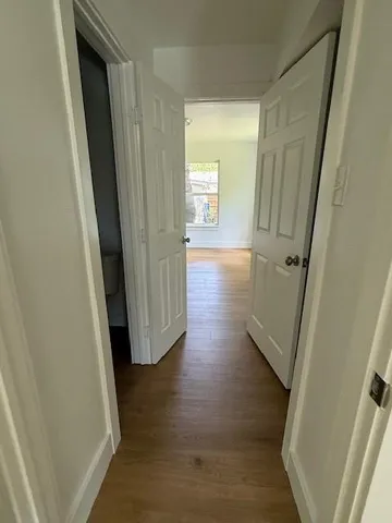 a bathroom with a toilet and bathtub