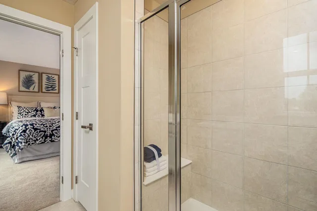 a bathroom with a bathtub and a shower