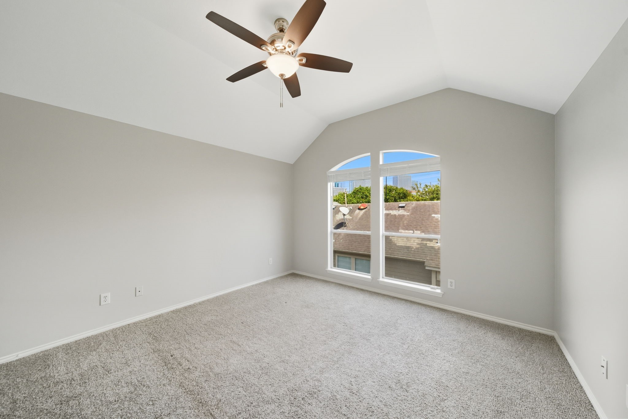 1507 Sutton Street Houston, TX 77006 - Photo 19 of 22 an empty room with windows and ceiling fan
