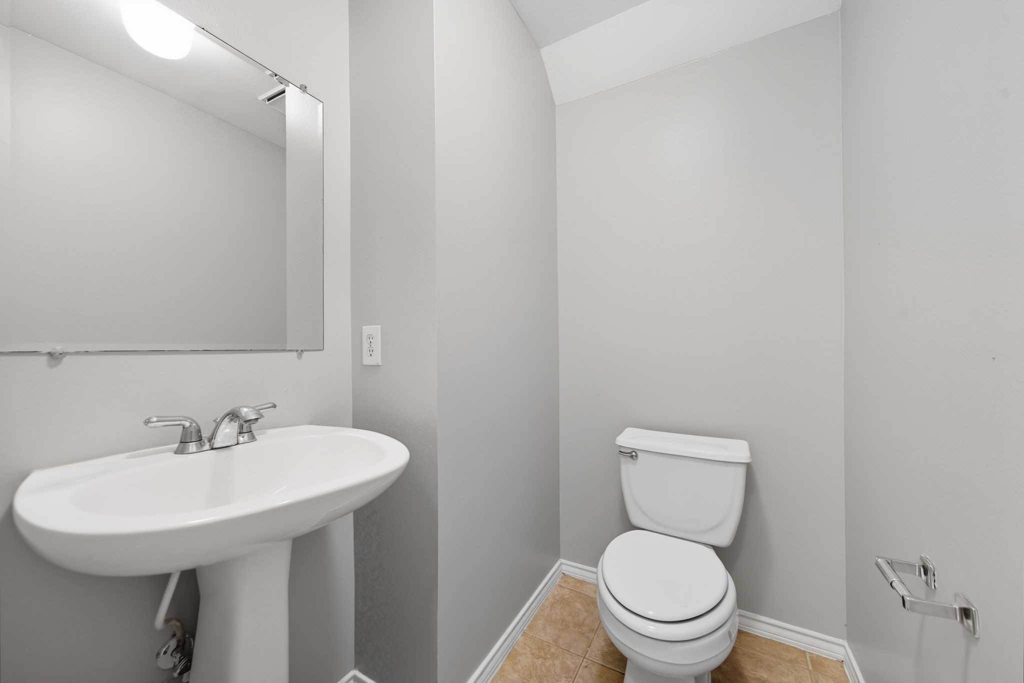 1507 Sutton Street Houston, TX 77006 - Photo 9 of 22 a bathroom with a toilet a sink and a mirror