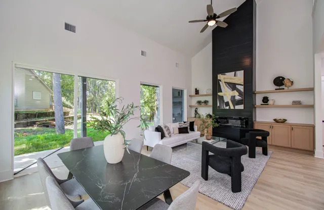 a living room with furniture rug and a window