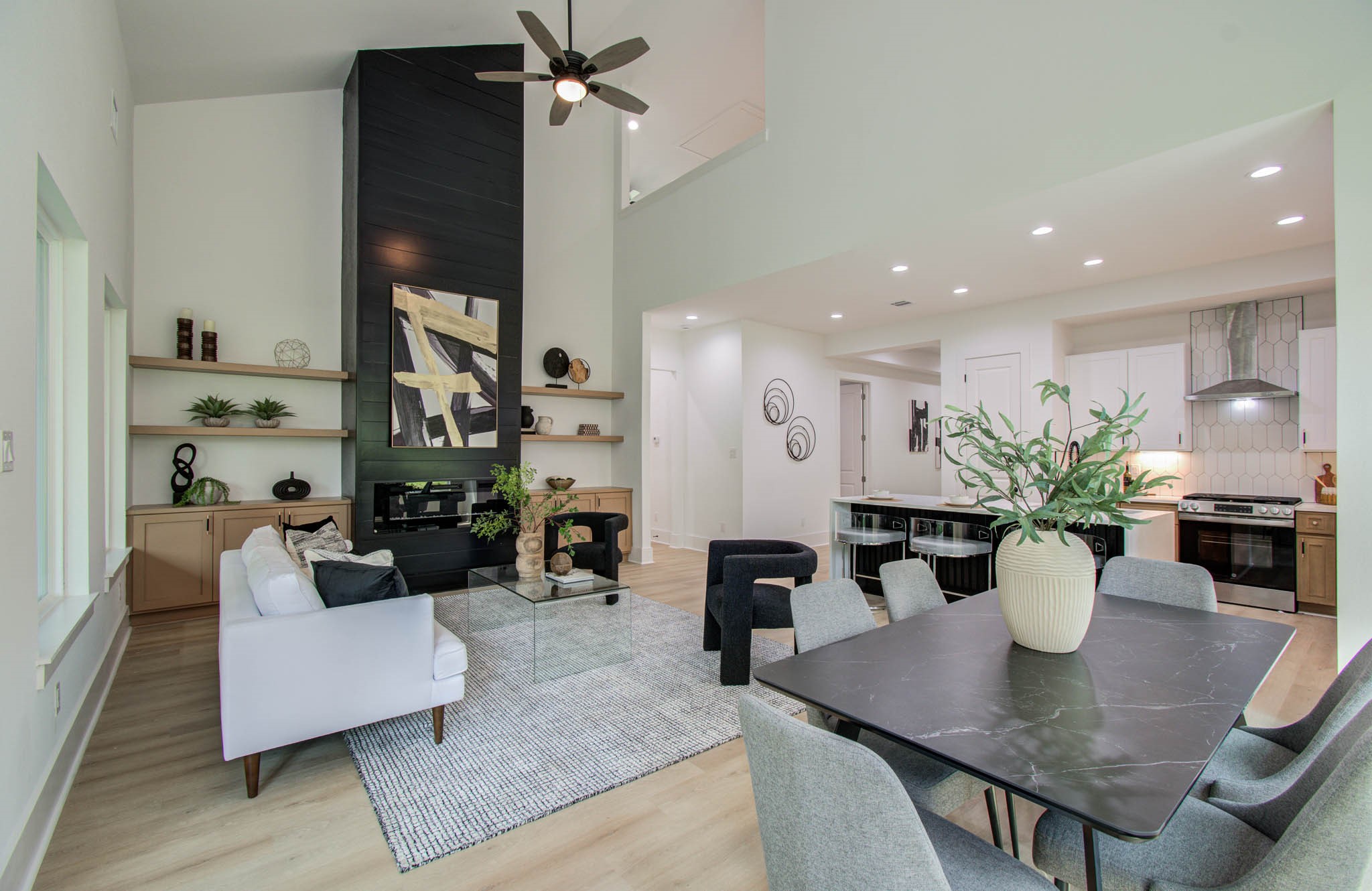 1802 Rollingwood Drive Huntsville, TX 77340 - Photo 13 of 38 a view of a dining room and livingroom with furniture wooden floor a chandelier