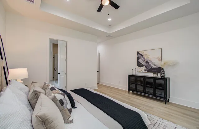 a bedroom with a bed and a dresser