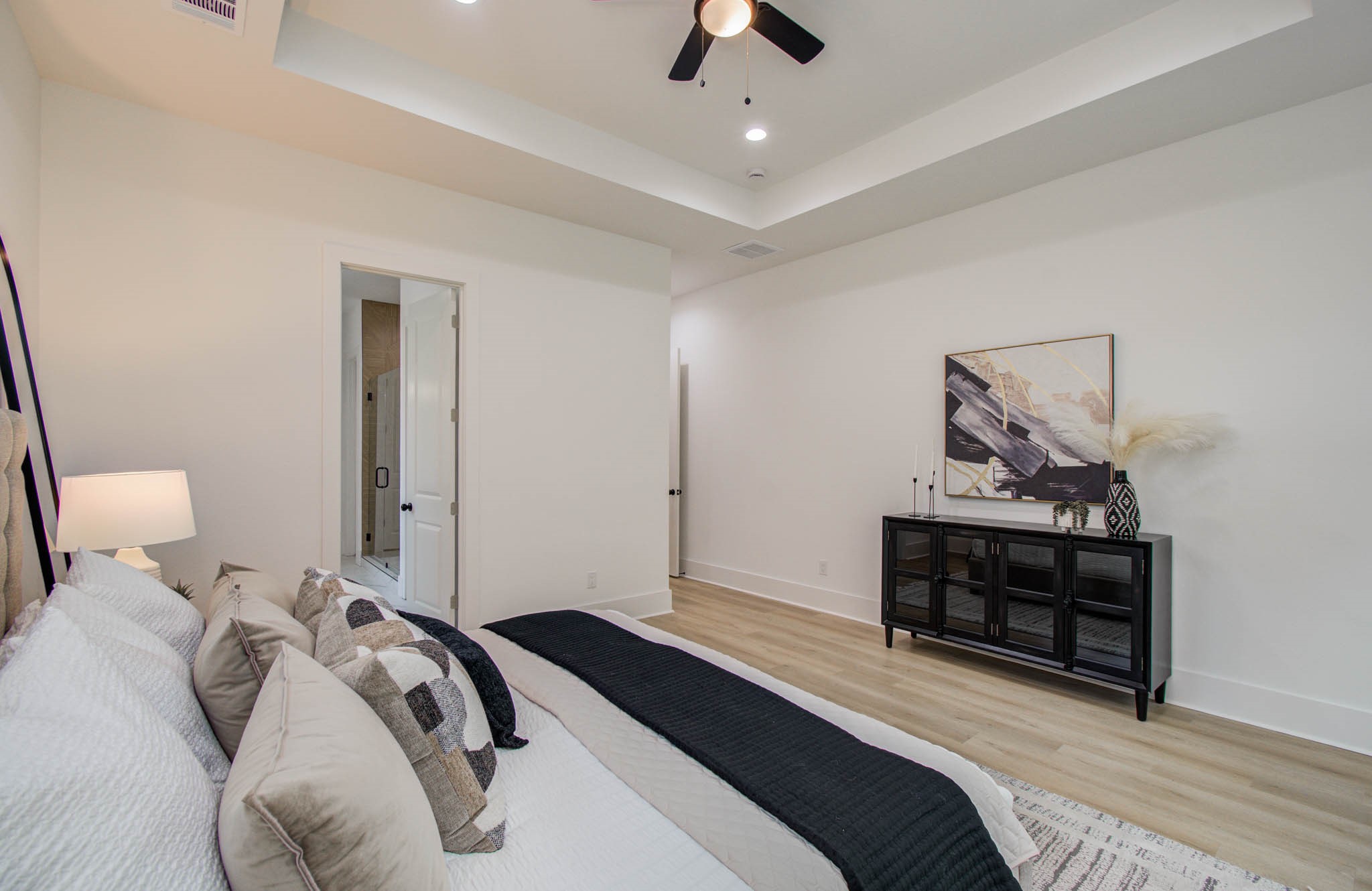 1802 Rollingwood Drive Huntsville, TX 77340 - Photo 16 of 38 a bedroom with a bed and a dresser