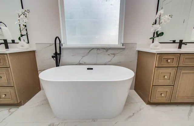 a white bath tub sitting in a bathroom