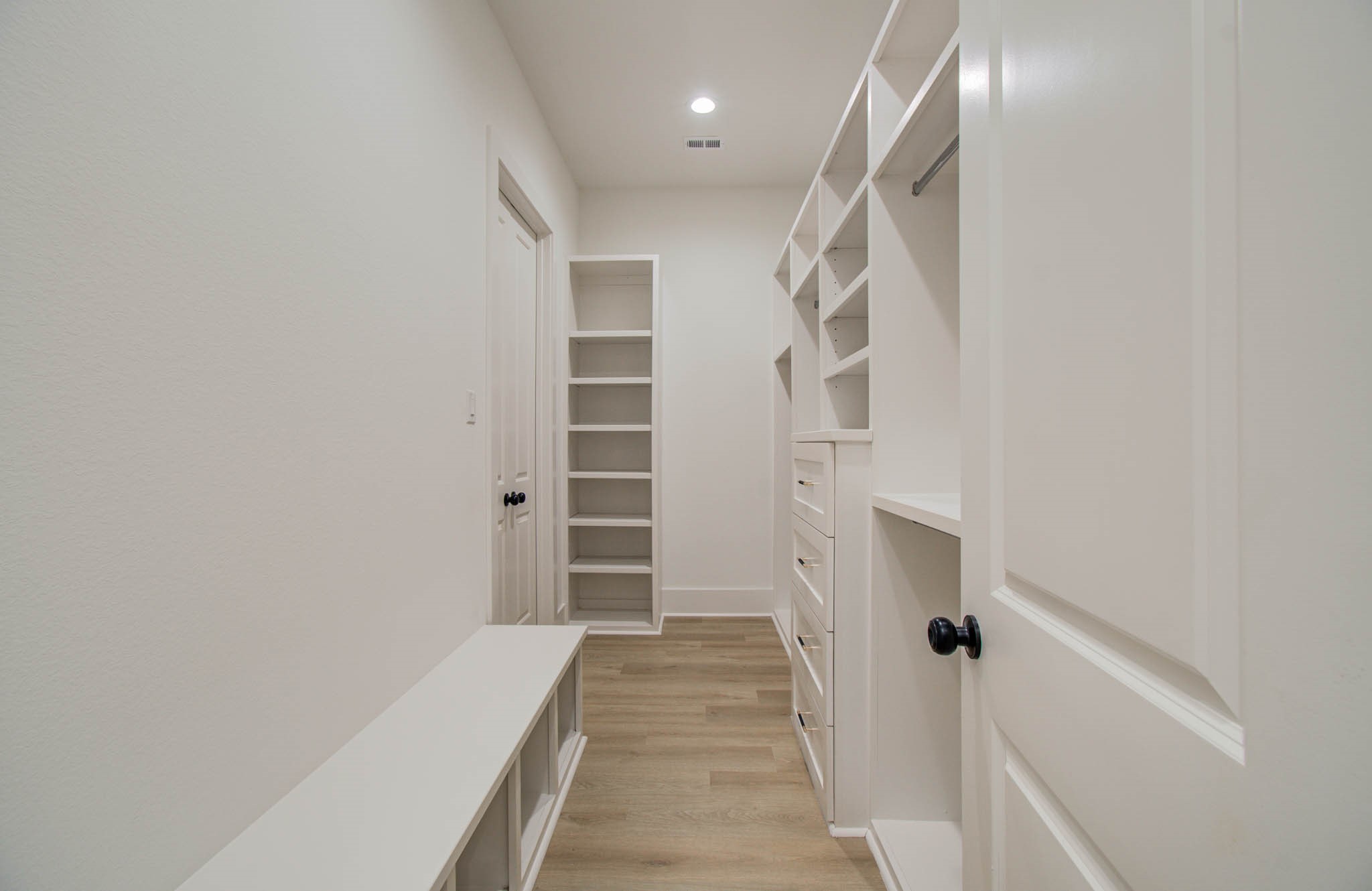 1802 Rollingwood Drive Huntsville, TX 77340 - Photo 22 of 38 a view of a hallway with wooden floor and entryway