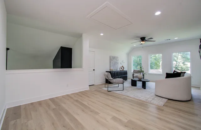 a view of a livingroom with furniture and wooden floor