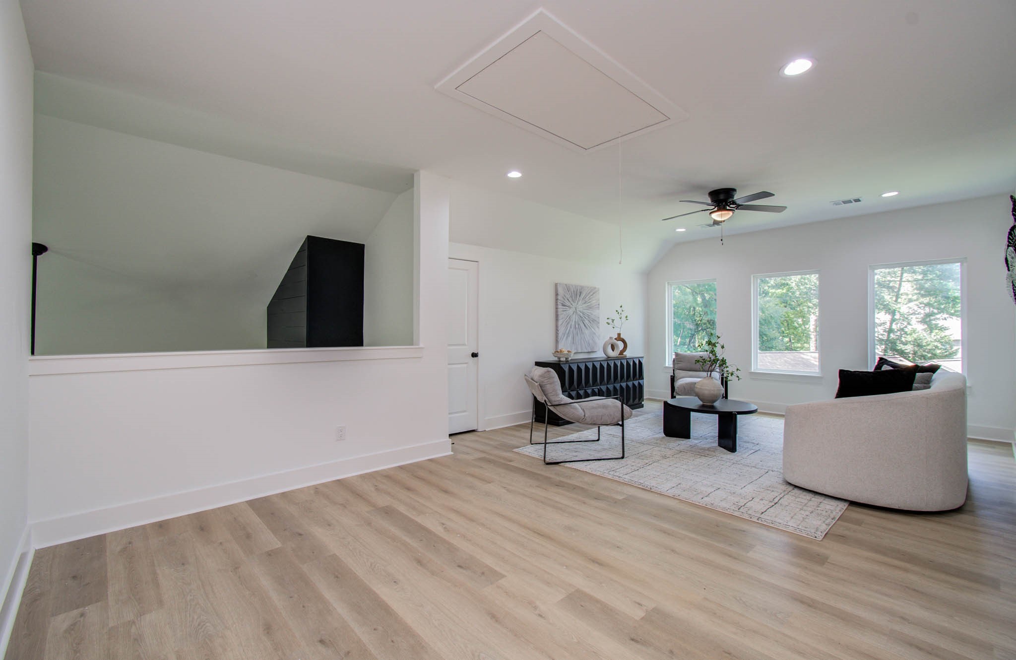 1802 Rollingwood Drive Huntsville, TX 77340 - Photo 24 of 38 a view of a livingroom with furniture and wooden floor