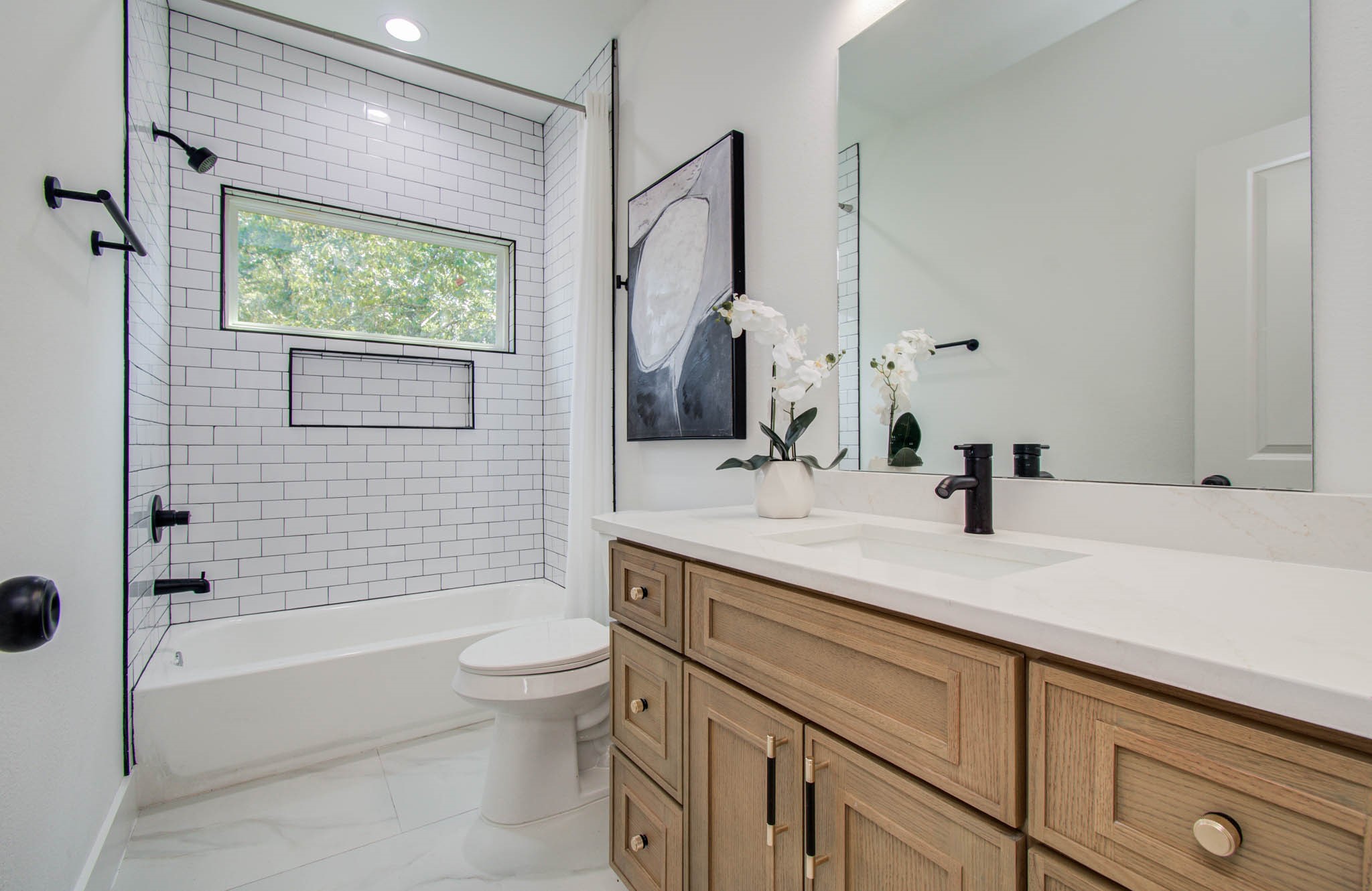 1802 Rollingwood Drive Huntsville, TX 77340 - Photo 29 of 38 a bathroom with a granite countertop sink toilet and shower