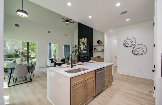 a room with a sink and a clock on the wall