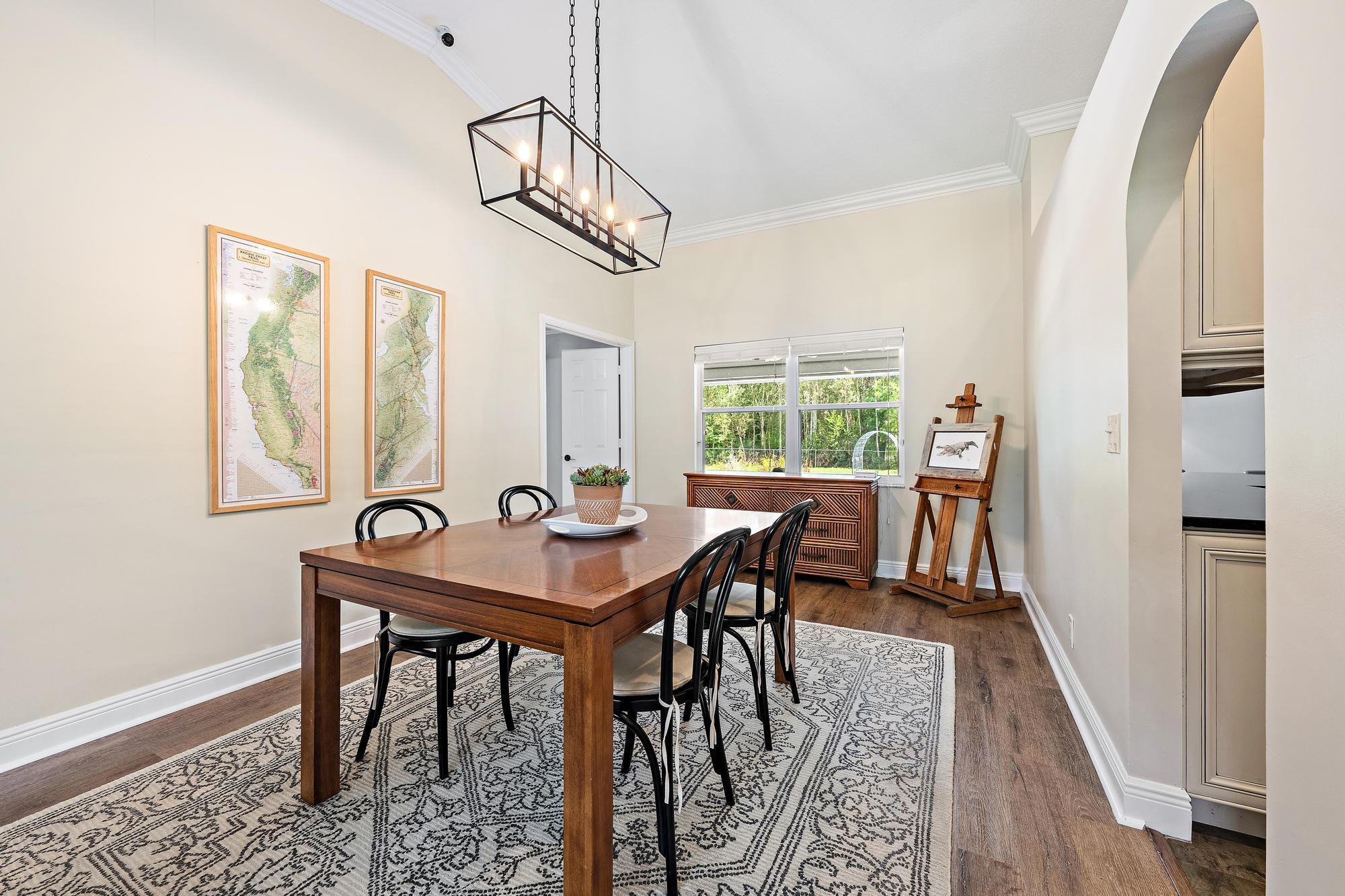 12177 86th Road North West Palm Beach, FL 33412 - Photo 13 of 40 a view of a dining room with furniture window and wooden floor