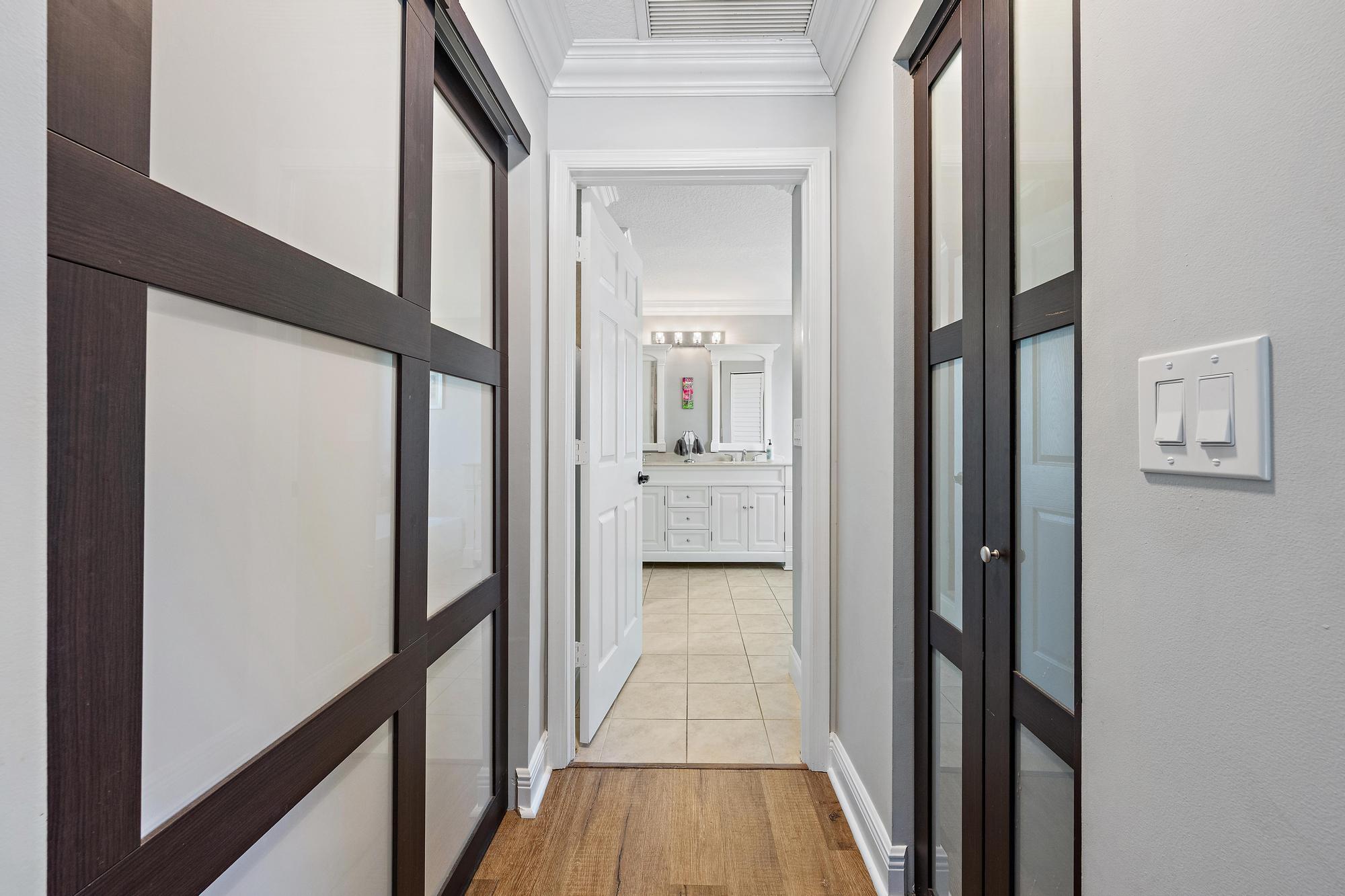 12177 86th Road North West Palm Beach, FL 33412 - Photo 16 of 40 a view of a bathroom from a hallway