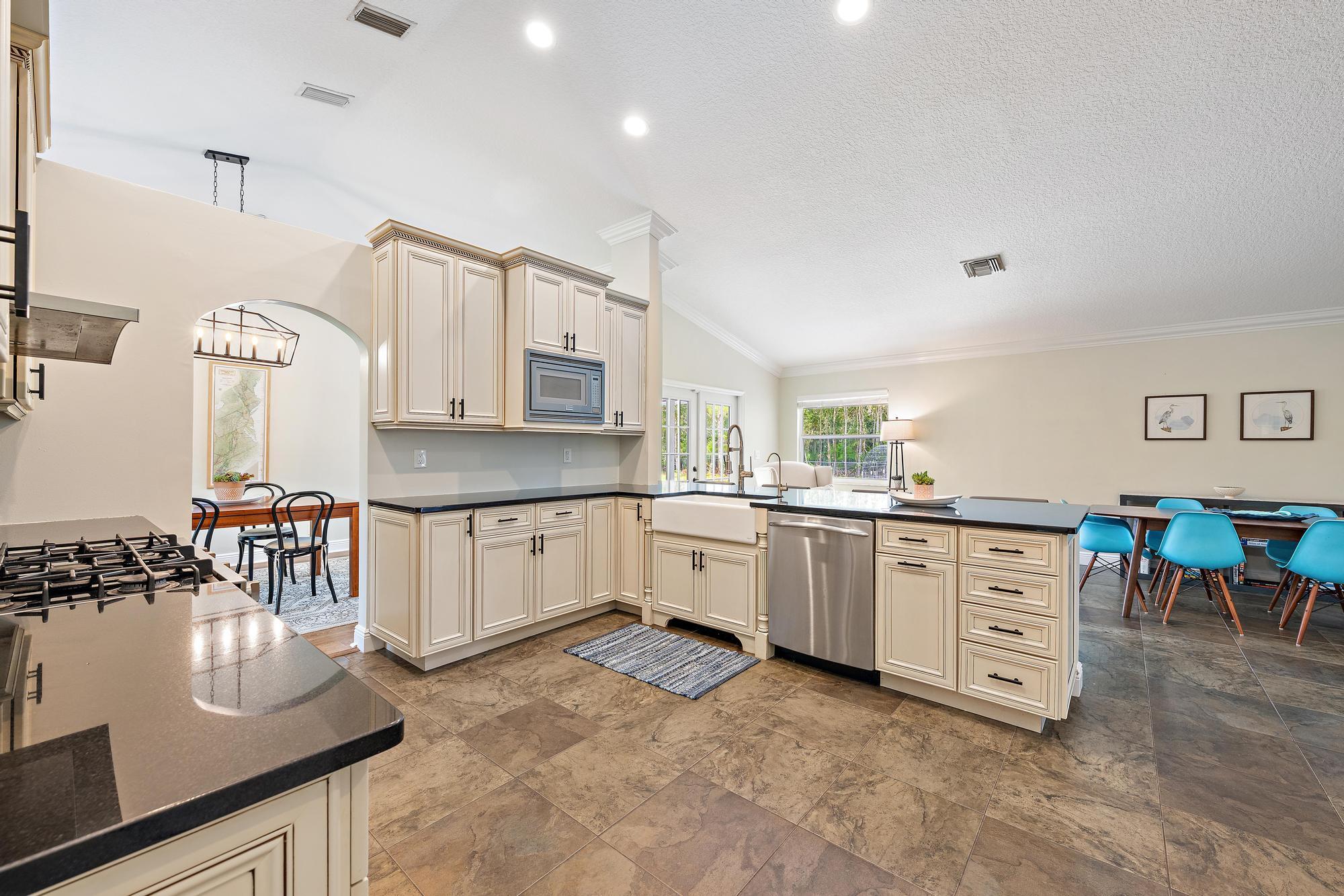 12177 86th Road North West Palm Beach, FL 33412 - Photo 25 of 40 a large white kitchen with cabinets