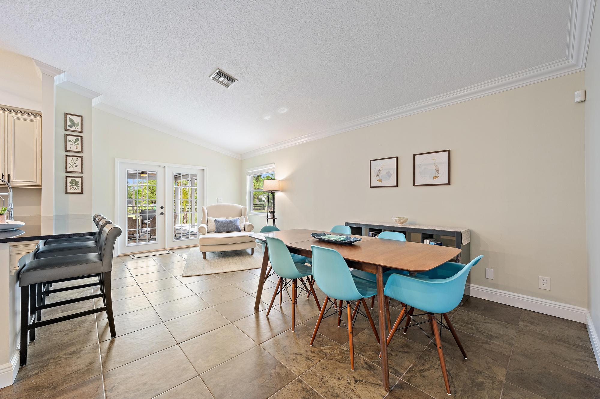12177 86th Road North West Palm Beach, FL 33412 - Photo 28 of 40 a view of a dining room with furniture