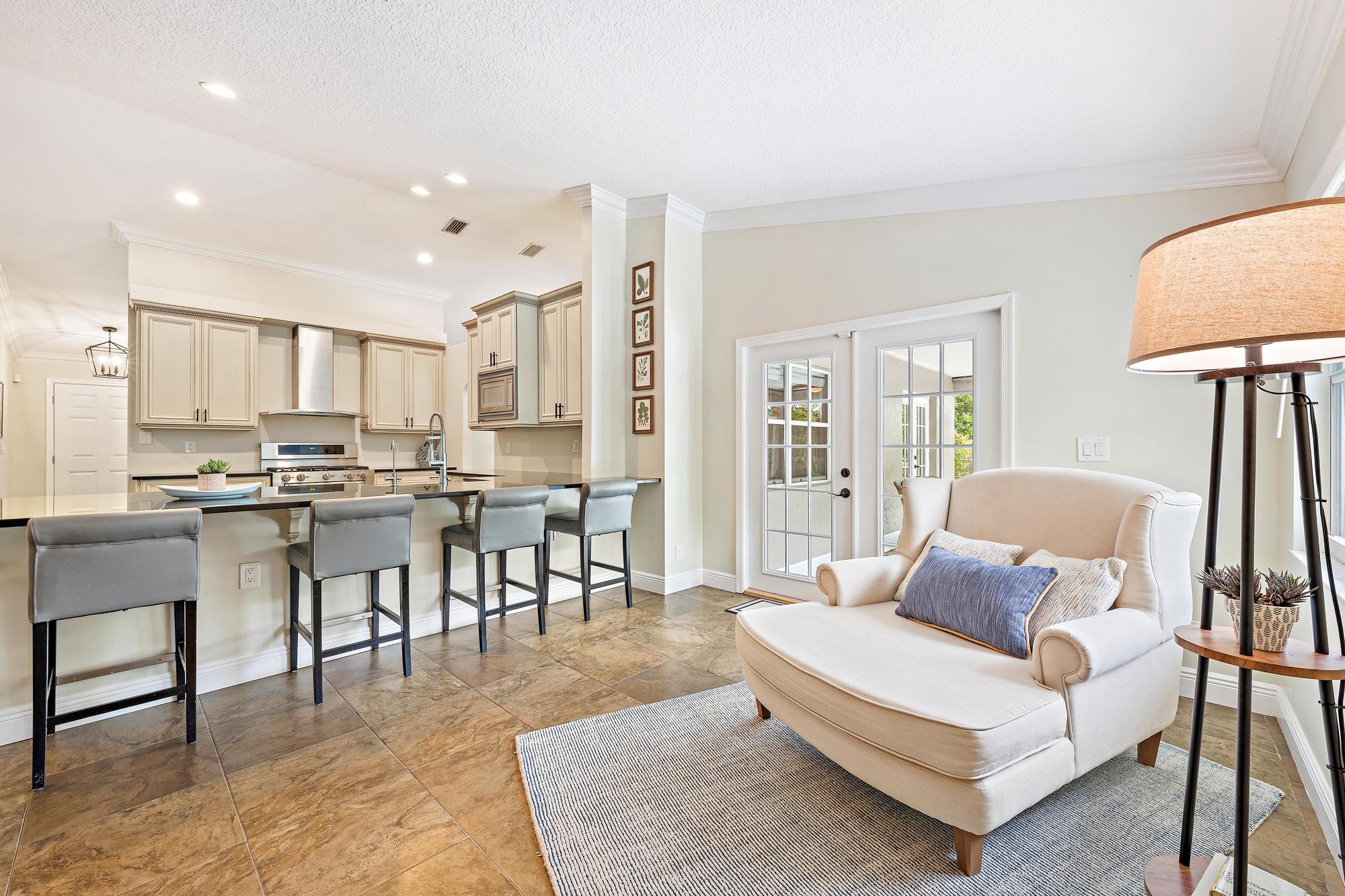 12177 86th Road North West Palm Beach, FL 33412 - Photo 29 of 40 a living room with furniture and a dining table with kitchen view