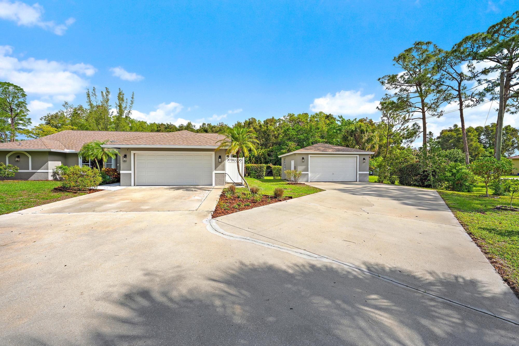 12177 86th Road North West Palm Beach, FL 33412 - Photo 3 of 40 a view of house with outdoor space and street view