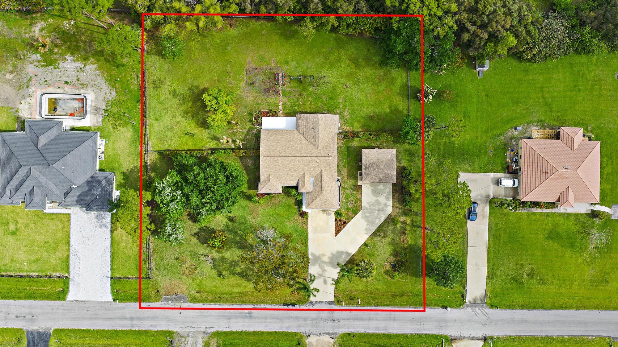 12177 86th Road North West Palm Beach, FL 33412 - Photo 32 of 40 an aerial view of a house with a yard basket ball court and outdoor seating