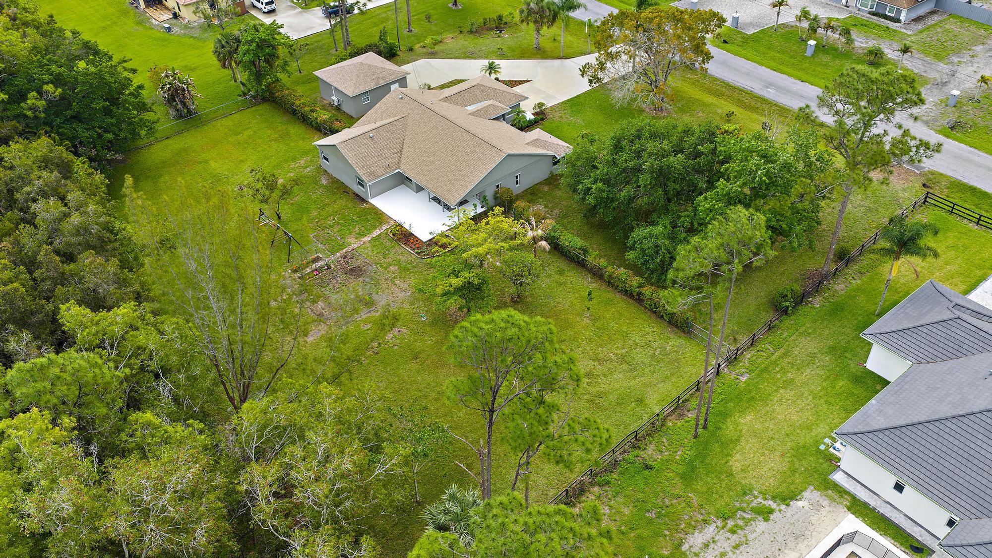 12177 86th Road North West Palm Beach, FL 33412 - Photo 36 of 40 an aerial view of residential house with outdoor space and trees all around