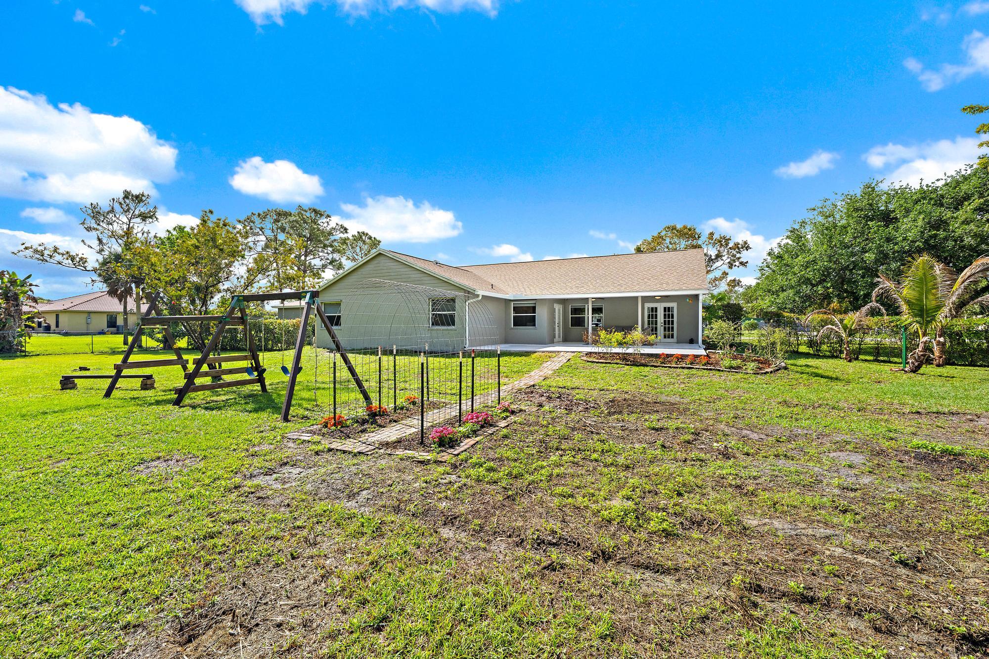 12177 86th Road North West Palm Beach, FL 33412 - Photo 40 of 40 a view of a house with a yard