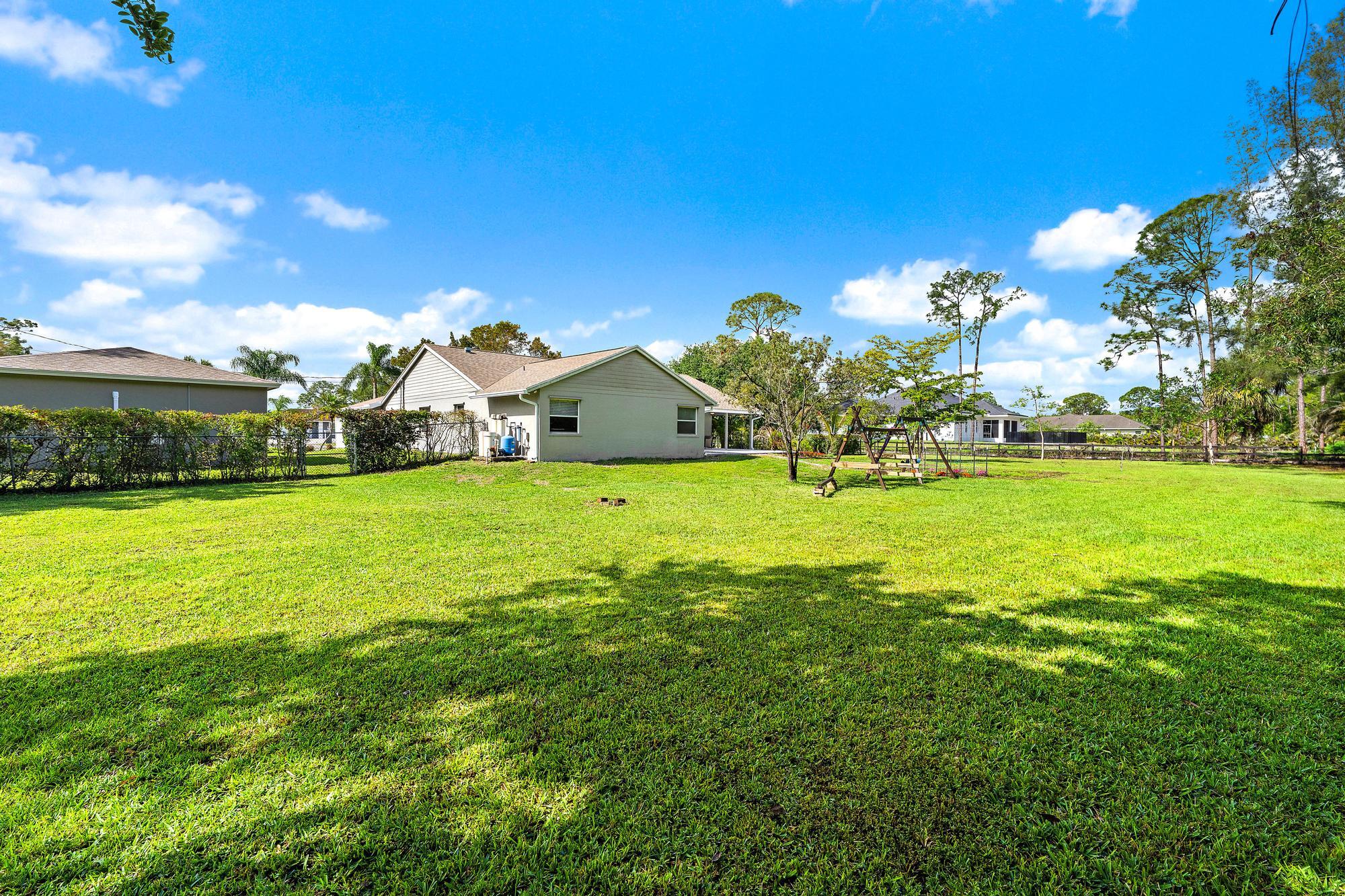 12177 86th Road North West Palm Beach, FL 33412 - Photo 4 of 40 a view of a volley ball court
