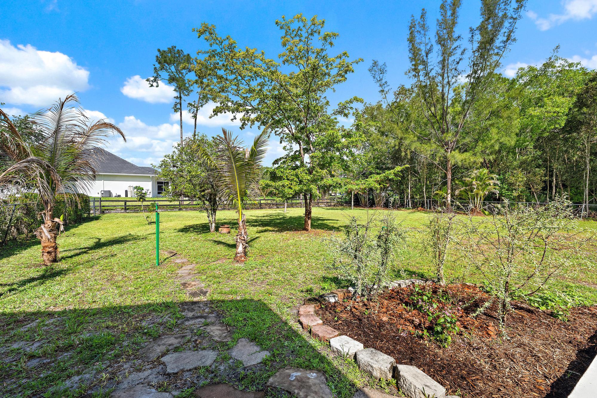 12177 86th Road North West Palm Beach, FL 33412 - Photo 8 of 40 a view of a park with large trees