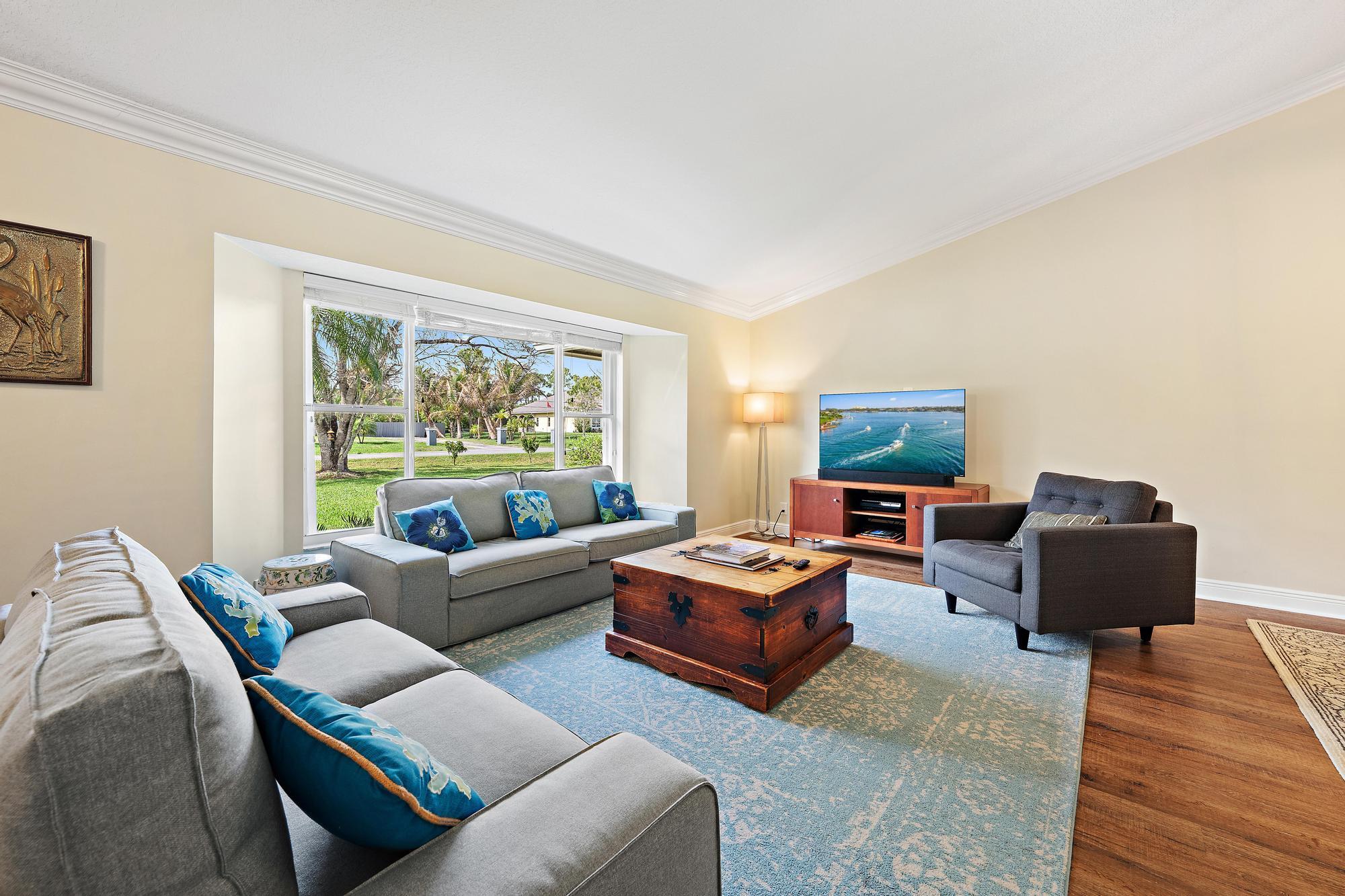 12177 86th Road North West Palm Beach, FL 33412 - Photo 10 of 40 a living room with furniture and a large window