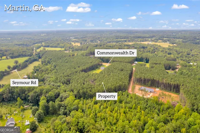 a view of a swimming pool with an outdoor space and seating area