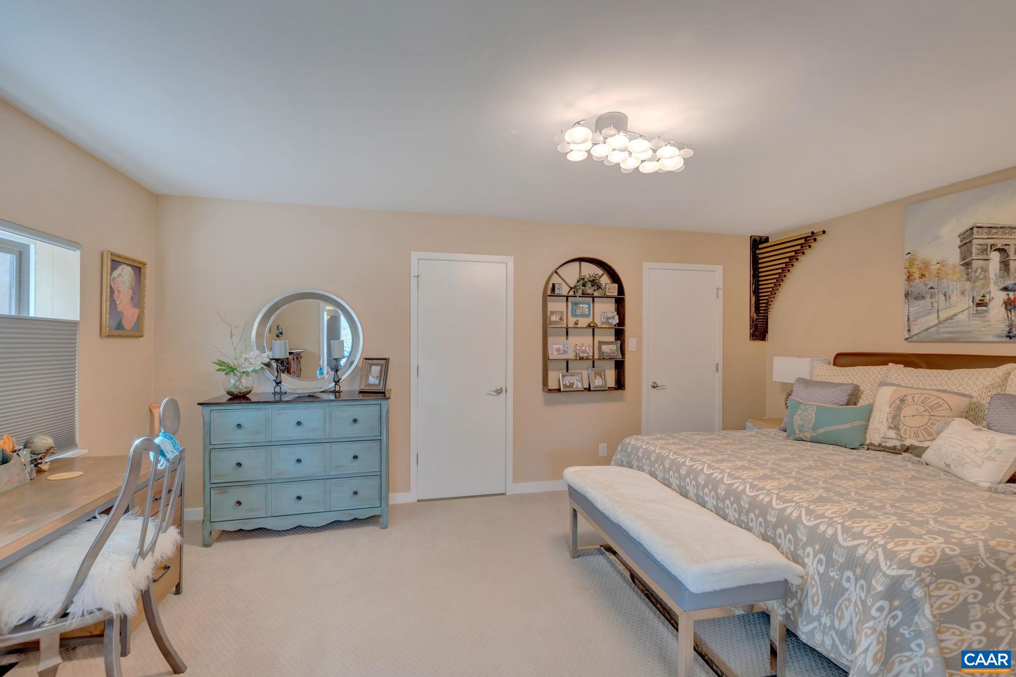 17 Bonita Road Palmyra, VA 22963 - Photo 26 of 74 a spacious bedroom with a bed a chandelier and a dresser