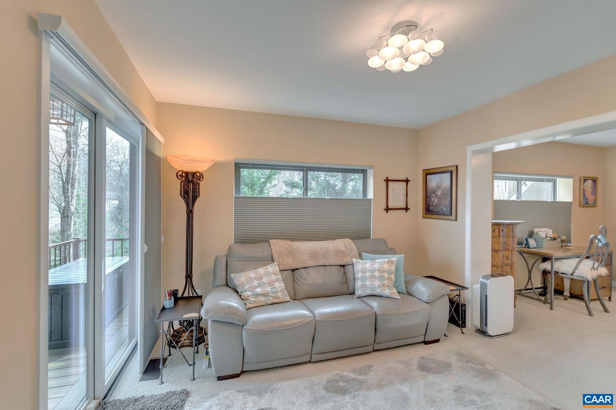 17 Bonita Road Palmyra, VA 22963 - Photo 30 of 74 a living room with furniture a large window and a chandelier