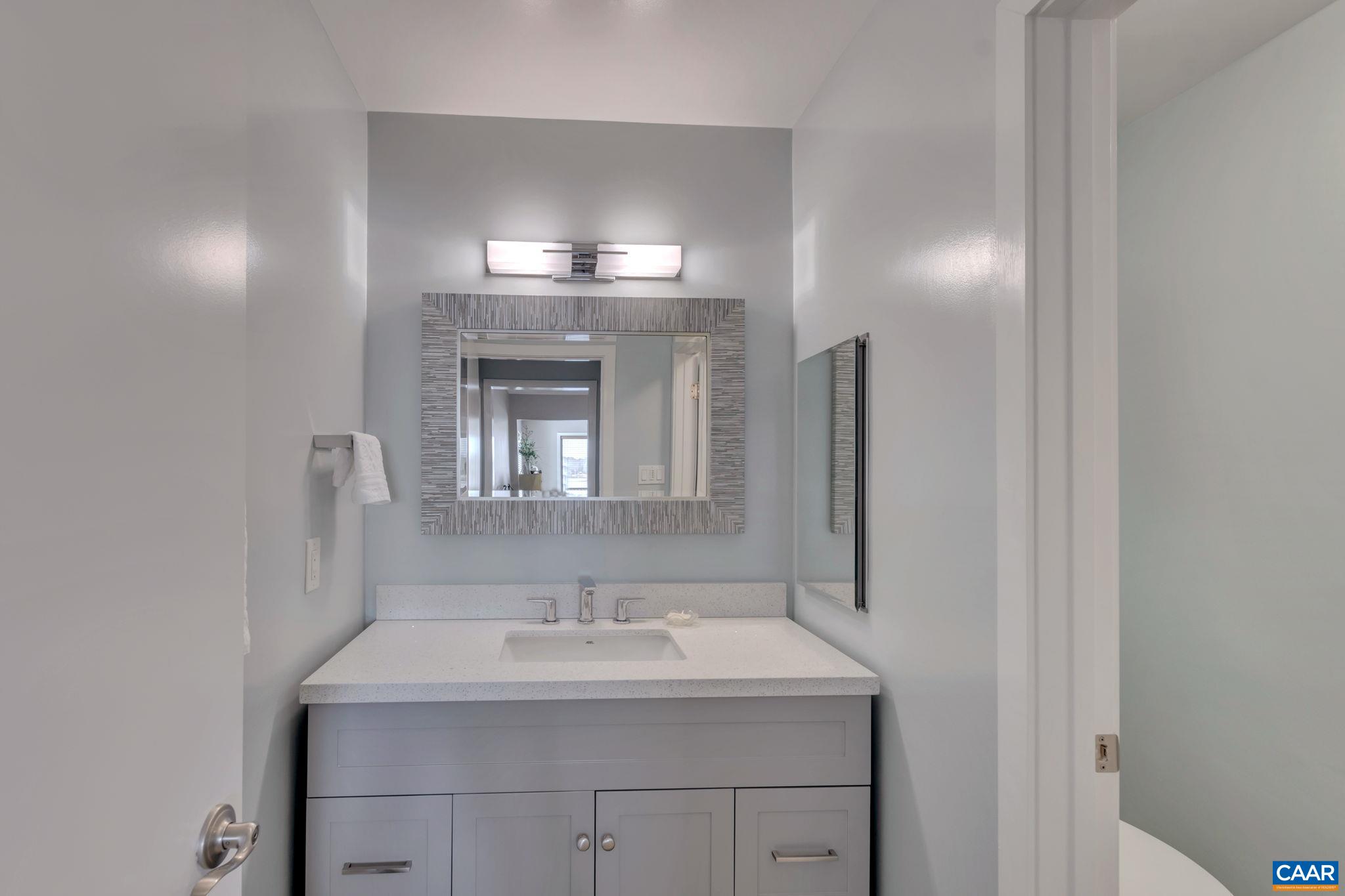 17 Bonita Road Palmyra, VA 22963 - Photo 39 of 74 a bathroom with a sink and a mirror