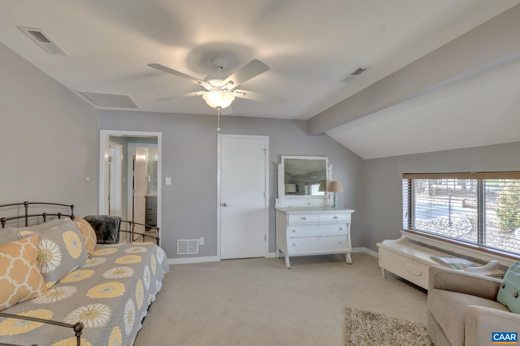 17 Bonita Road Palmyra, VA 22963 - Photo 41 of 74 a spacious bedroom with a bed and a chandelier