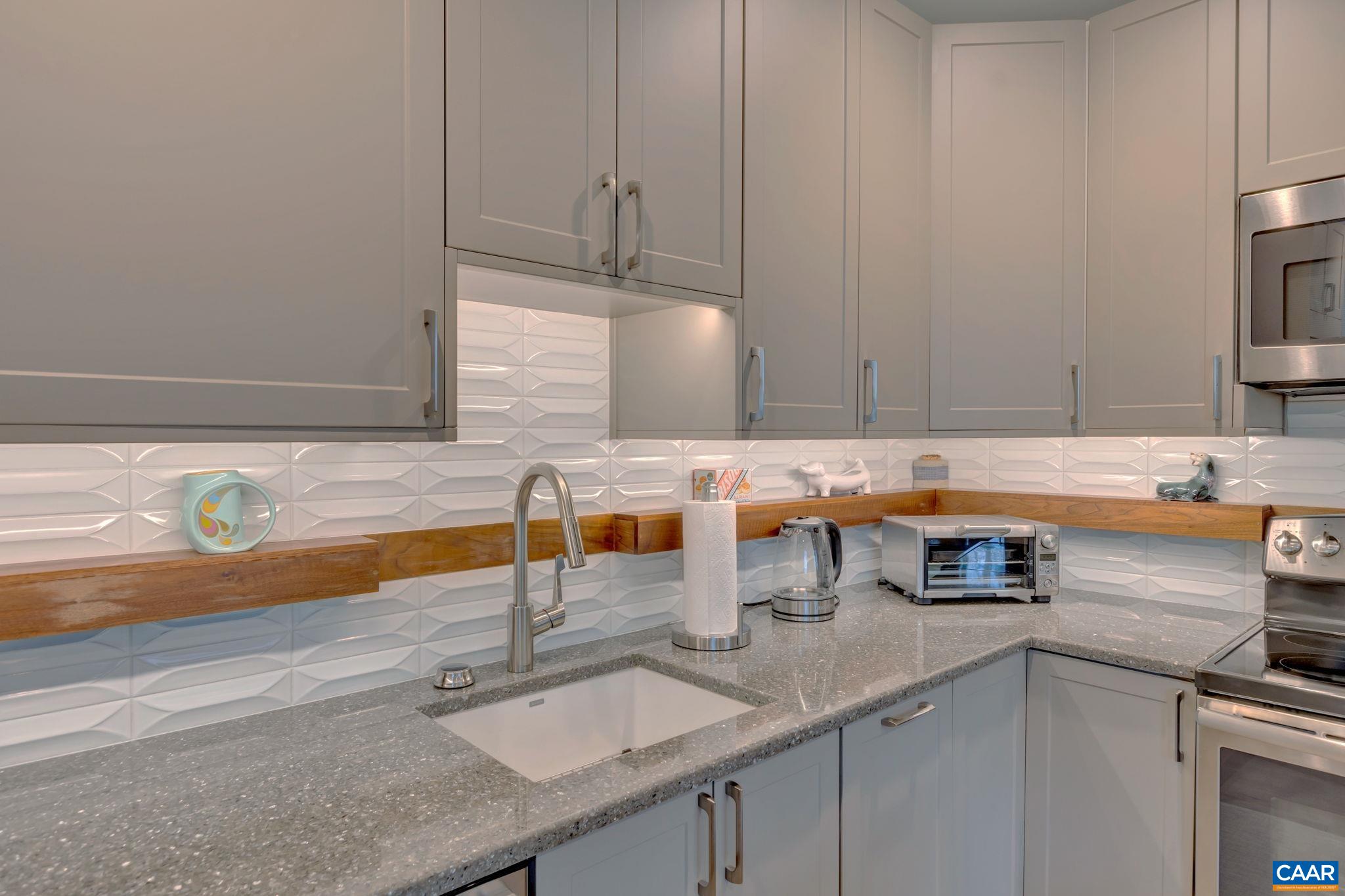 17 Bonita Road Palmyra, VA 22963 - Photo 49 of 74 a kitchen with stainless steel appliances granite countertop a sink and a white cabinets