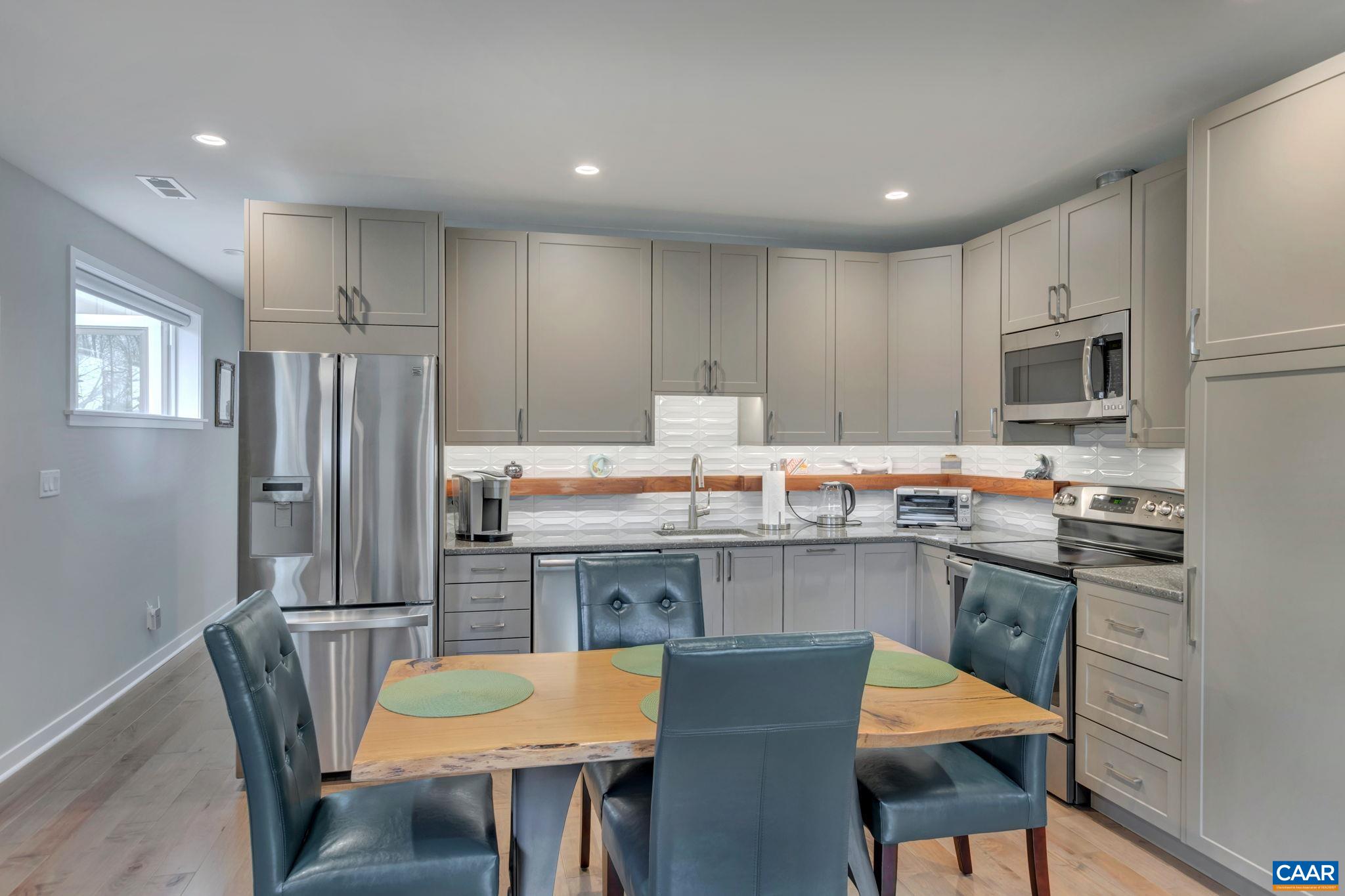 17 Bonita Road Palmyra, VA 22963 - Photo 52 of 74 a kitchen with stainless steel appliances granite countertop a kitchen island hardwood floor sink and stove