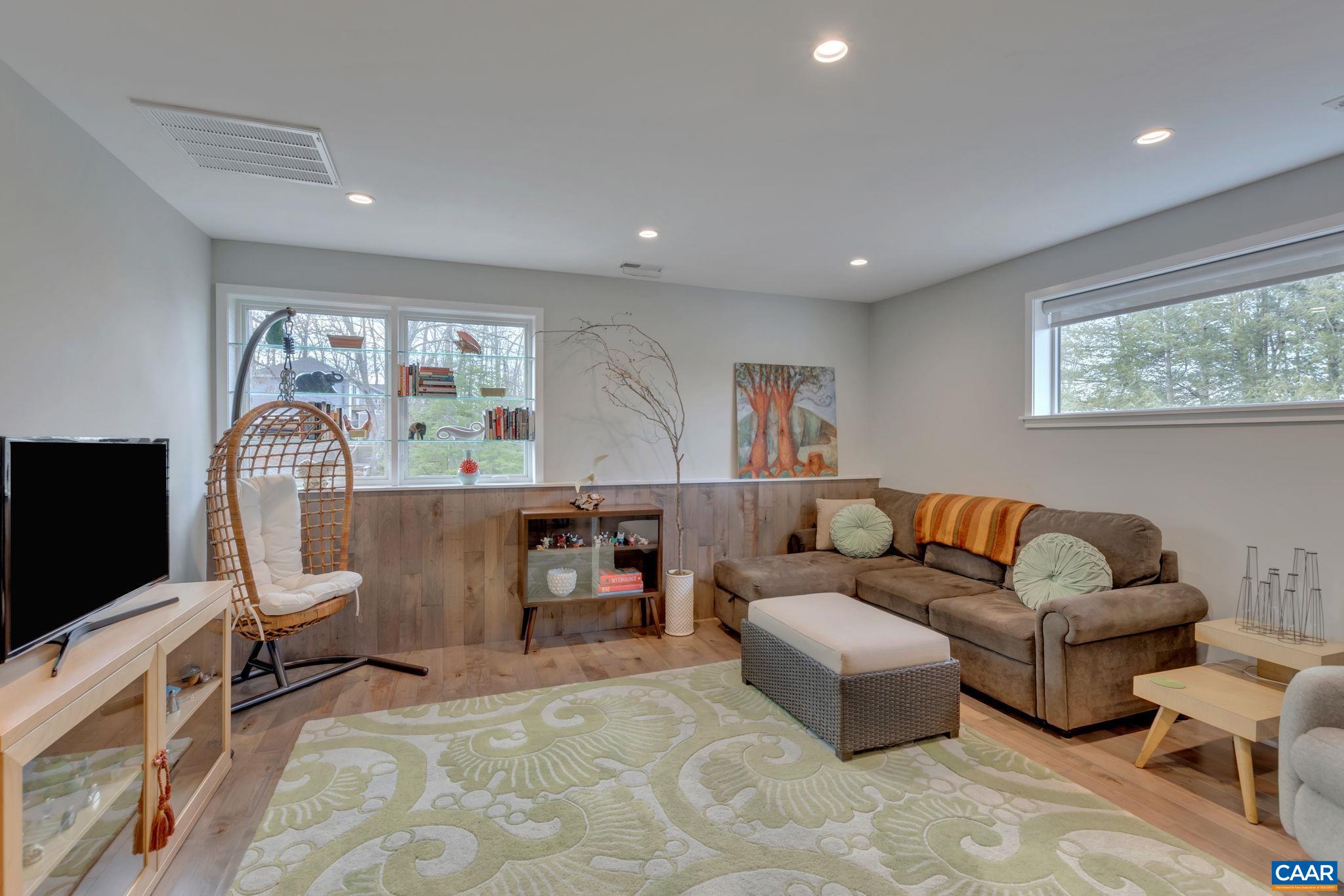17 Bonita Road Palmyra, VA 22963 - Photo 62 of 74 a living room with furniture and a flat screen tv
