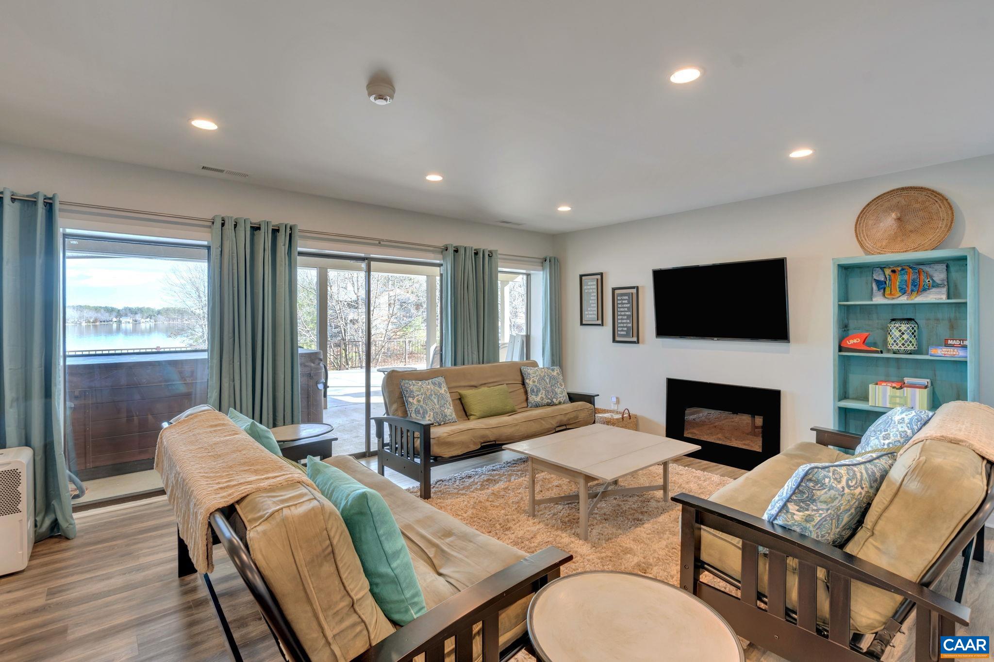 17 Bonita Road Palmyra, VA 22963 - Photo 64 of 74 a living room with furniture fireplace and a flat screen tv