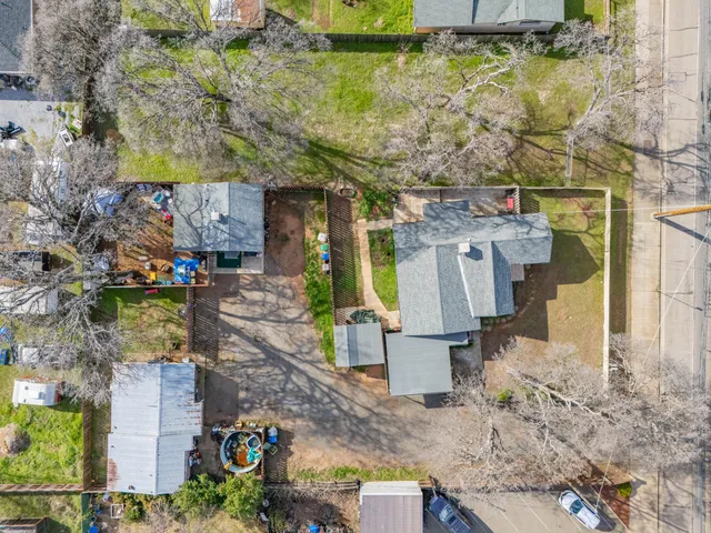 an aerial view of residential houses with outdoor space