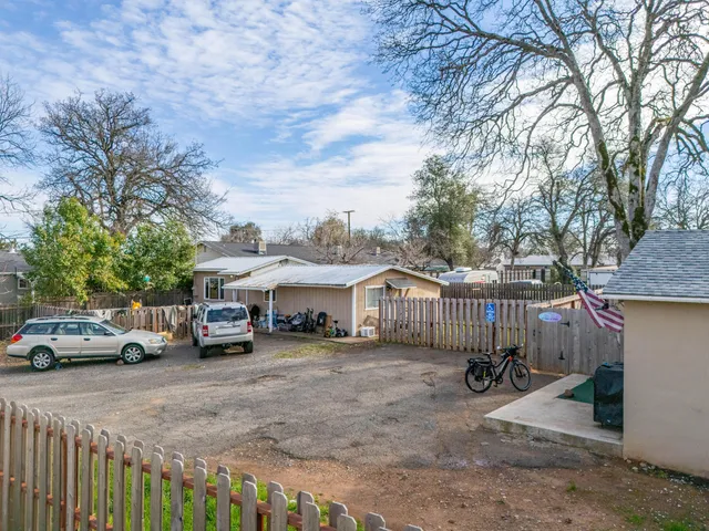 a view of street with parked cars