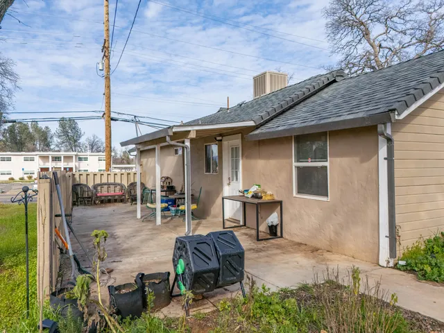 a backyard of a house with seating space