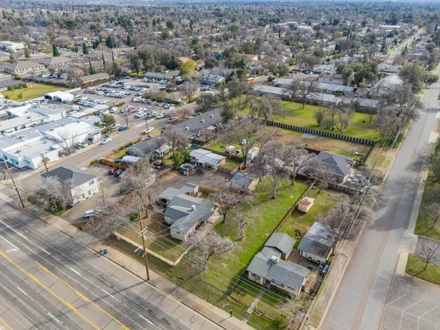 an aerial view of residential houses with outdoor space